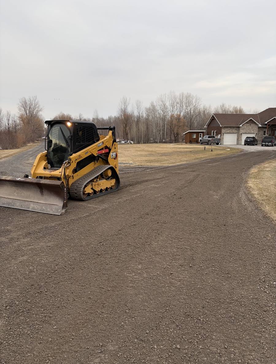 CAT track loader grading a residential lot in Russell Ontario