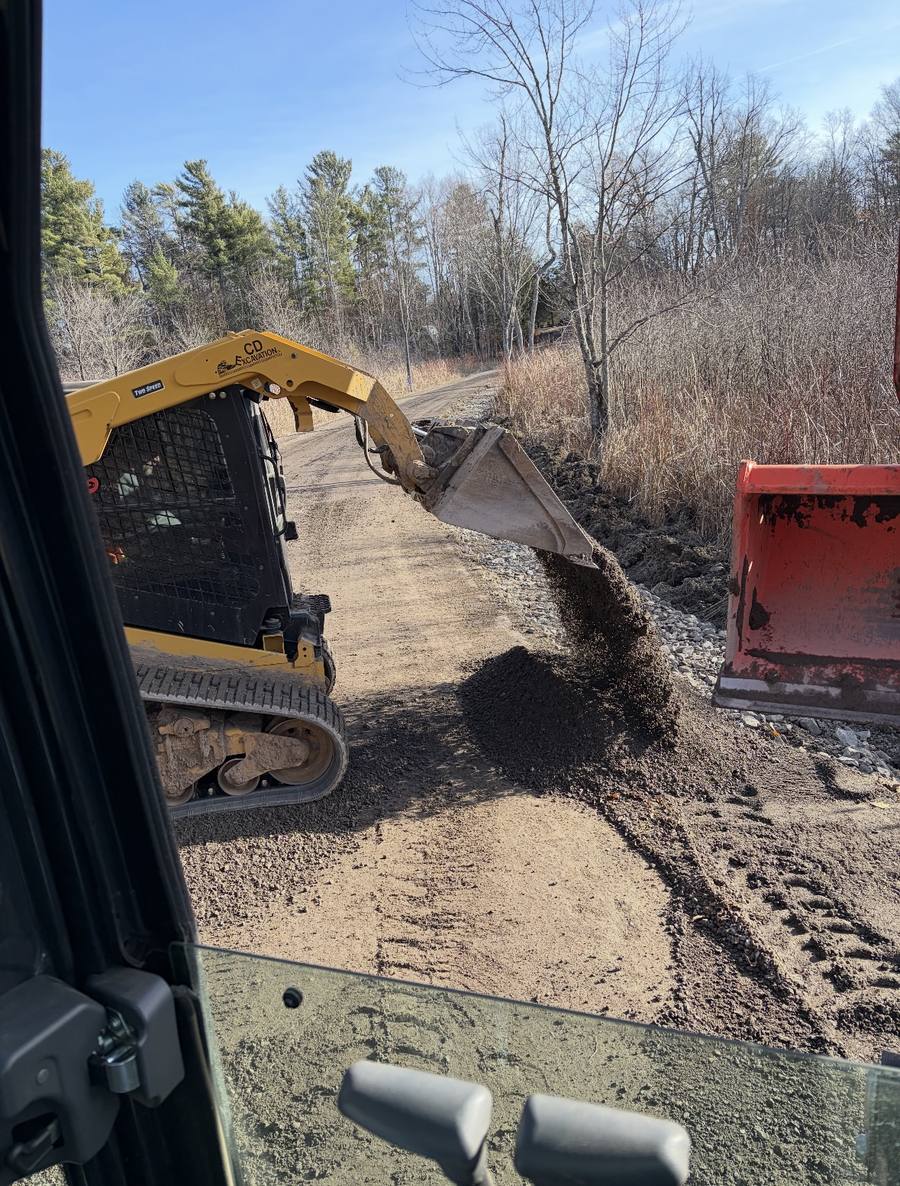 CD Excavation skid steer working on a driveway in Eastern Ontario